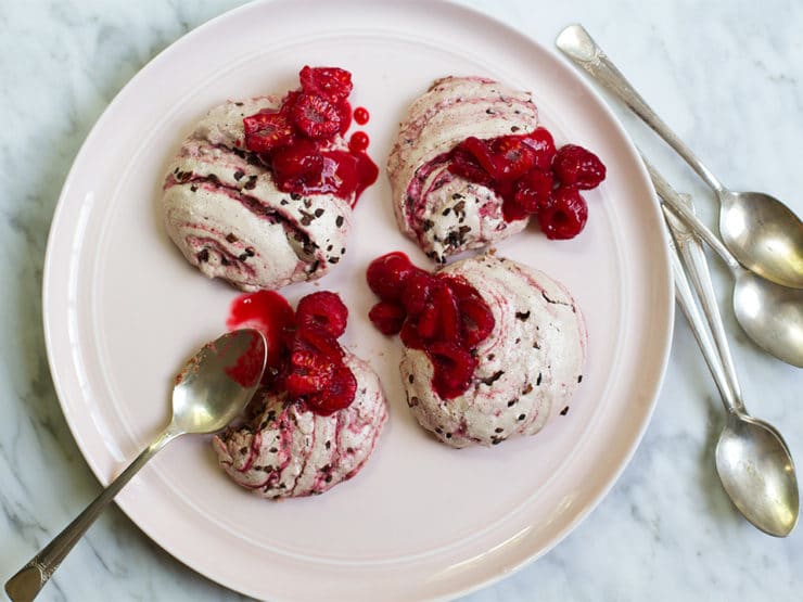 Decadent raspberry cacao ripple rochers on a white plate with spoons