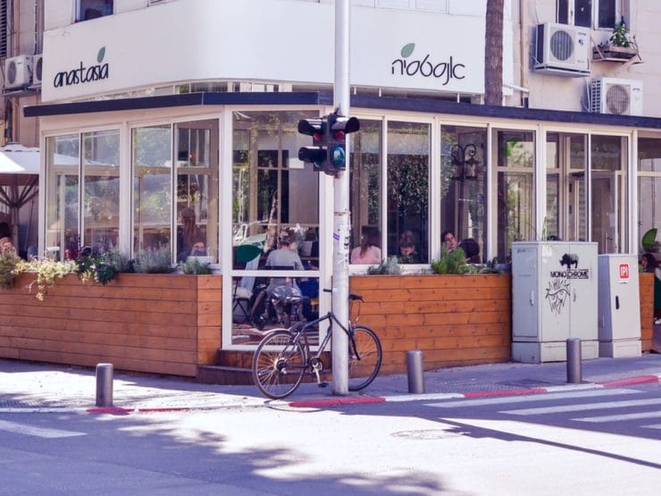 Corner restaurant - Anastasia Restaurant Tel Aviv - at a street intersection with stoplight.