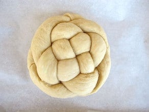 Challah loaf on parchment.