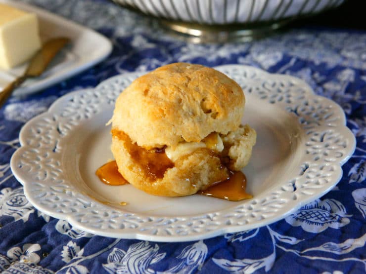 Easy buttery and delicious biscuit served on a fancy plate with delicious syrup