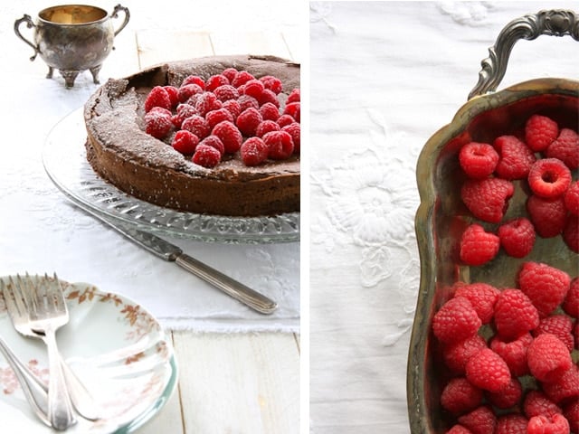 A collage of Flourless Chocolate Hazelnut Cake, one is served on a fancy glass plate topped with raspberries and a serving of raspberries on the left right