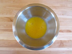 Beaten eggs in a bowl.