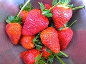 Rinsed and dried strawberries in a bowl.