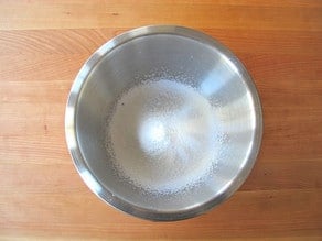 Powdered sugar sifted into a mixing bowl.