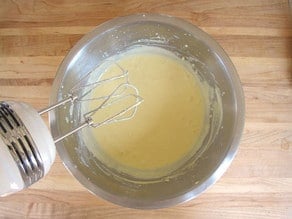 Blending sour cream into cake batter.