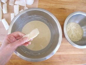 Fish dipped into batter.