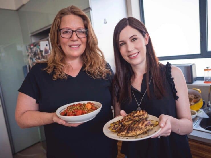 Adeena Sussman and Tori Avey cooking together in Adeena\'s kitchen, Tel Aviv, Israel.