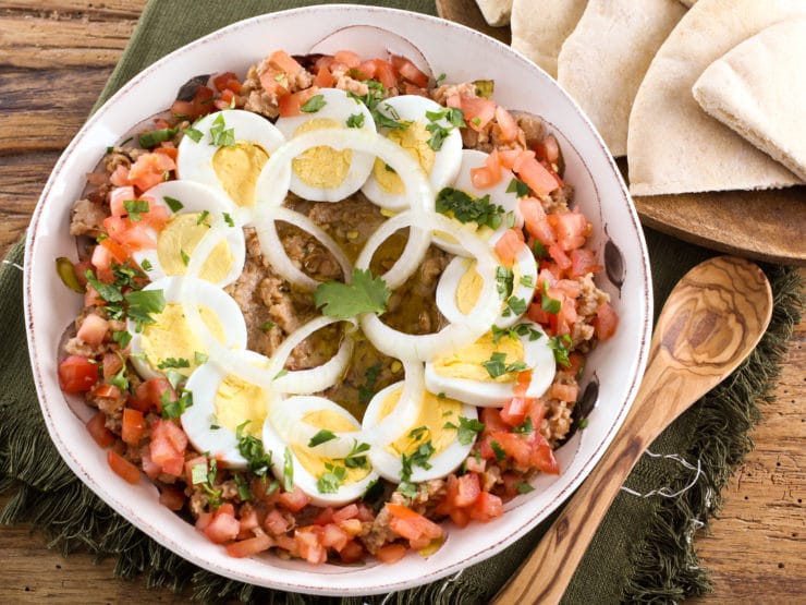 Overhead shot of Ful Mudammas, a traditional Middle Eastern dish made with cooked fava beans