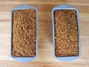 Two loaf pans of baked cake.