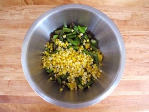 Grilled veggies, diced into a bowl.