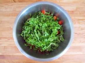 Grilled veggies, diced into a bowl.