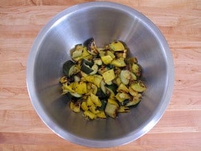 Grilled veggies, diced into a bowl.