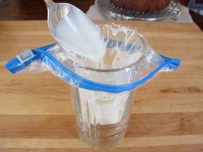 Adding icing to a ziptop bag.