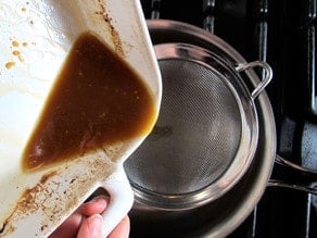 Straining pan drippings.