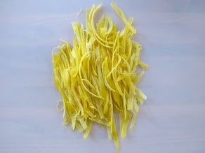 Dainty strips of lemon peel.