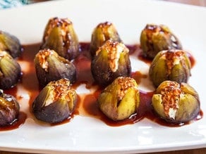 Close-up image of Stuffed Figs arranged in a white plate.