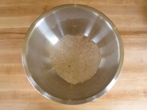 Flour sifted into a mixing bowl.