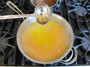 Covering risotto with broth.