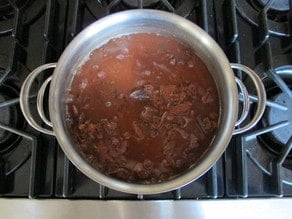 Dates in boiling water on the stove.