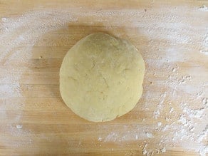 Dough ball kneaded on a counter.