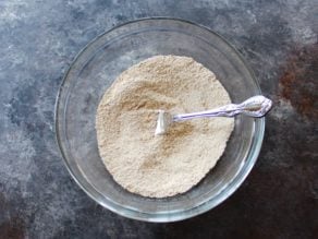 Dry mixture in glass mixing bowl with a fork.