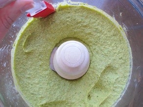 Pureed hummus in food processor.