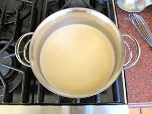 Bechamel sauce simmering on the stove.