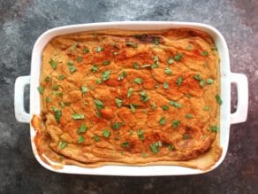 Fully baked Hummus Baked Vegan Moussaka with fresh parsley garnish.