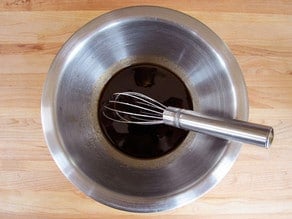 Balsamic dressing in a small bowl.