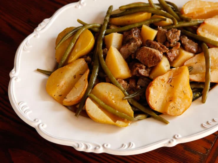 Horizontal cut image of Swedish Lamb Stew with Pears, featuring potatoes, green beans, and meat