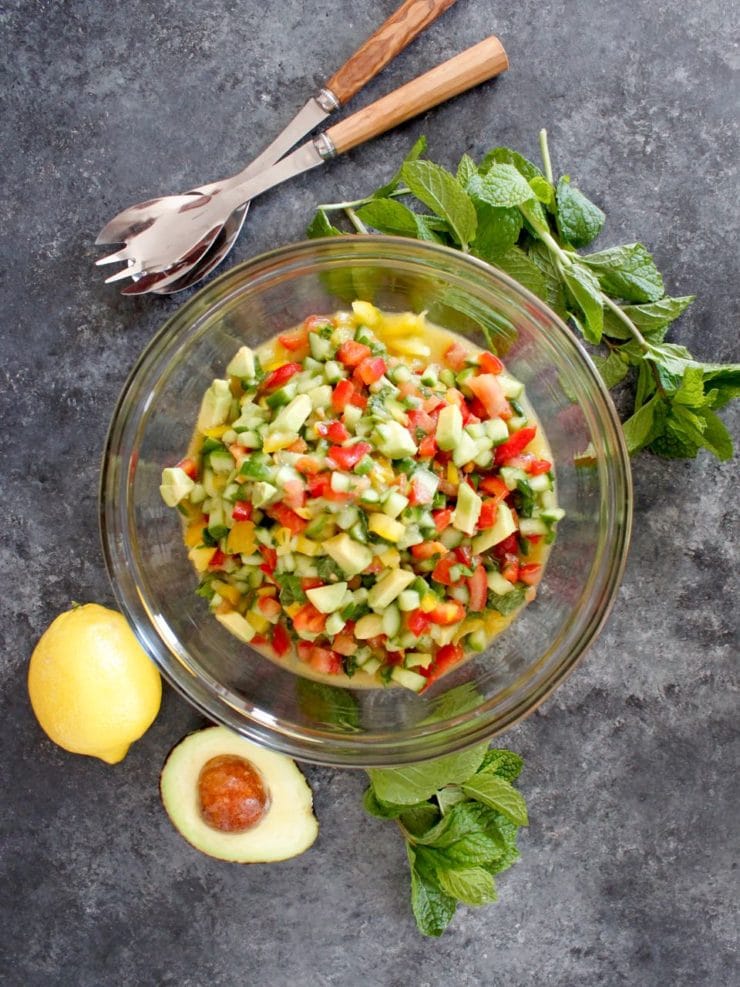 Israeli Salad with Avocado and Mint - Crunchy fresh and healthy salad with cucumber, tomatoes, bell peppers, lemon and mint. 