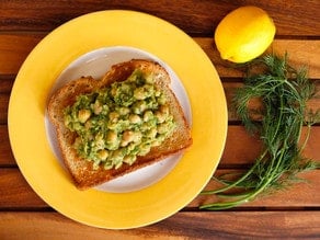 Chickpea and lemon pesto toast topped with lemon-dill chickpea avocado salad