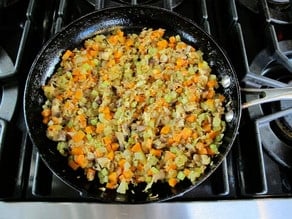 Mushrooms added to skillet.