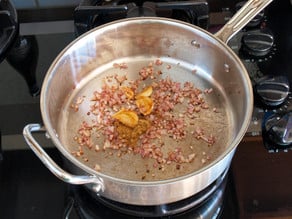 Toasting spices in a skillet.