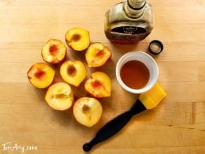 Grilled Peach Sundae with Brandy Butterscotch Sauce - Recipe for grilled ripe peaches and creamy caramelized sauce over vanilla frozen yogurt. 