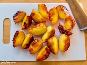 Grilled Peach Sundae with Brandy Butterscotch Sauce - Recipe for grilled ripe peaches and creamy caramelized sauce over vanilla frozen yogurt. 