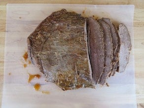 Slicing brisket against the grain.