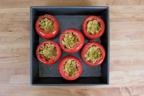 Cored tomatoes stuffed with quinoa.