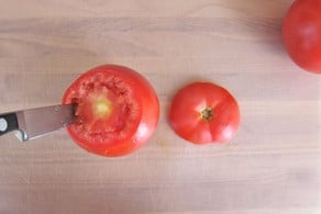 Coring flesh from tomatoes.