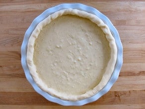 Apple filling poured into unbaked crust.