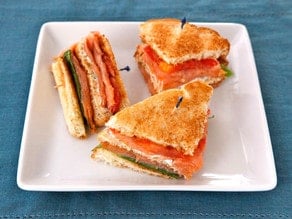 Smoked Salmon Club Sandwich - A simple and delicious club sandwich with smoked salmon, capers, cream cheese spread, lettuce and tomato. Kosher.