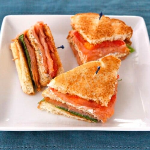 Smoked Salmon Club Sandwich - A simple and delicious club sandwich with smoked salmon, capers, cream cheese spread, lettuce and tomato. Kosher.