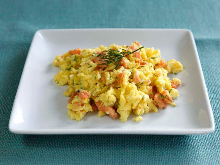 Smoked Salmon Goat Cheese Scramble - Irresistible breakfast recipe with fluffy scrambled eggs, creamy goat cheese, smoked salmon and fresh dill by Tori Avey.