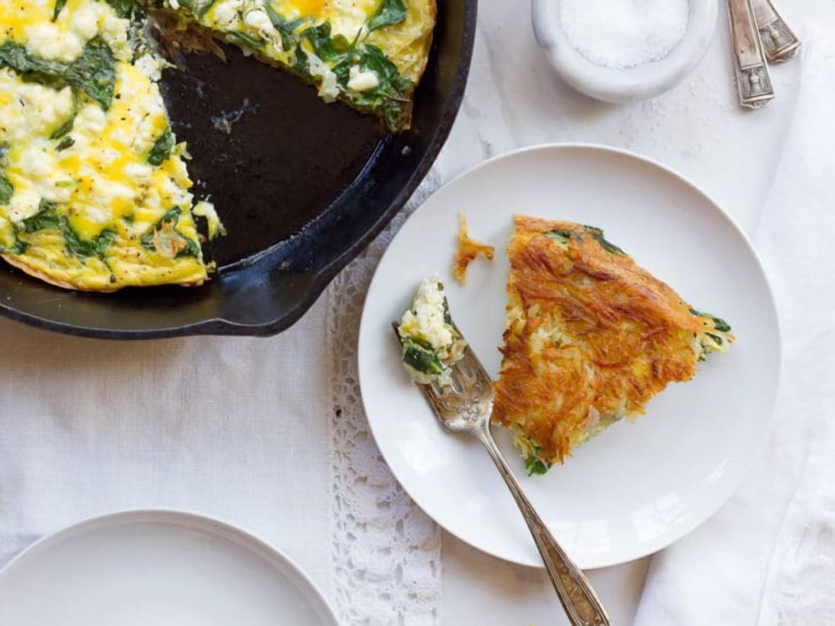 A delicious spinach and feta frittata served on a plate, ready to be enjoyed