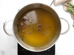 Overhead shot of a stock pot filled with turkey brine.