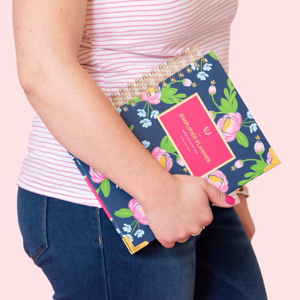 Alexandra of The Productivity Zone carrying a Navy Blooms Daily Simplified Planner
