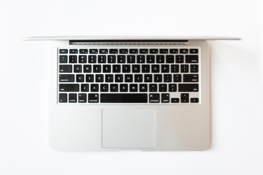 Bird's-eye view of a MacBook Pro open on white background